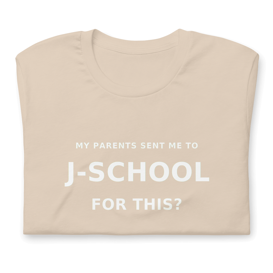 My Parents Sent Me to J-School for This? statement tee on a light-colored shirt.