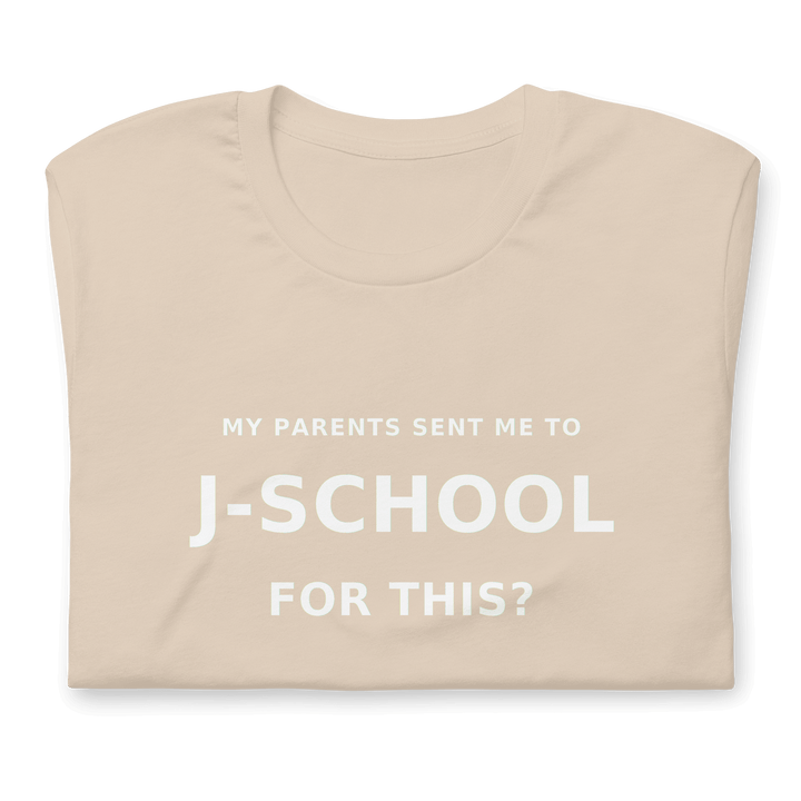 My Parents Sent Me to J-School for This? statement tee on a light-colored shirt.
